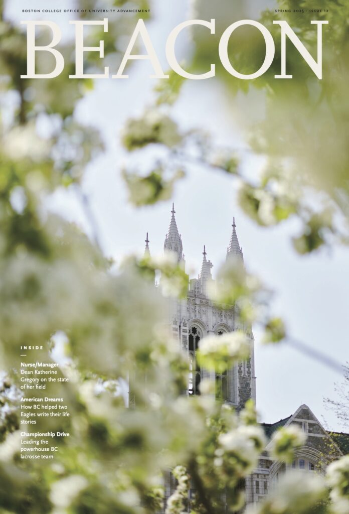 A magazine cover titled "Beacon" featuring the pointed spires of a gothic-style building in the background. The foreground is blurred with green, leafy branches in focus, giving a sense of depth and springtime.