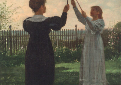 Two women in Victorian-era dresses play with handheld sticks and hoops in a grassy garden. They're positioned in profile, facing each other with a wooden fence in the background under a partly cloudy sky.