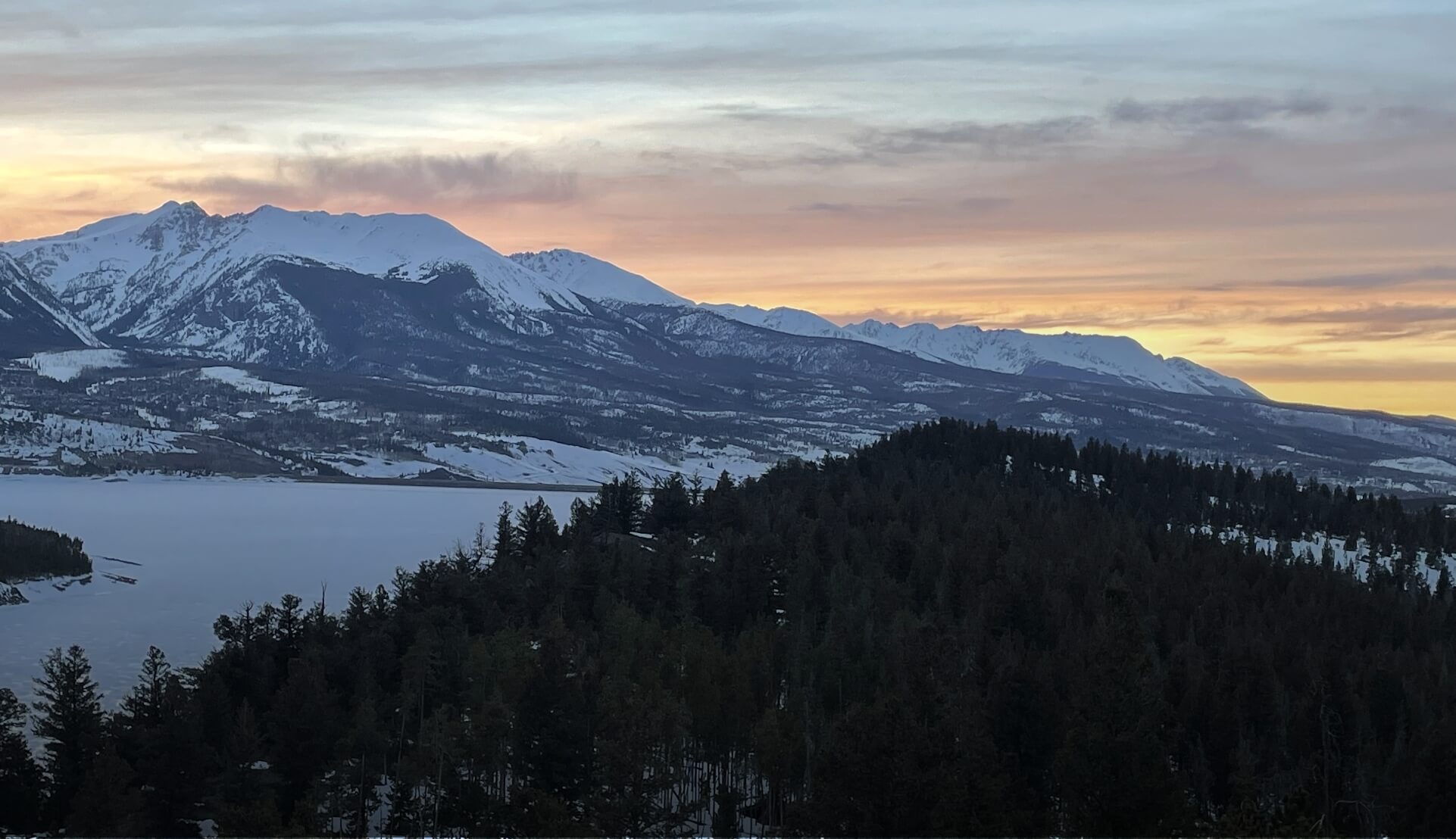 finding-her-purpose a snowcovered mountain with the sun setting behind it