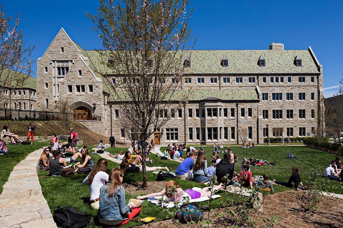 Students relax on West Lawn’s terraced amphitheater in front of Stokes Hall.