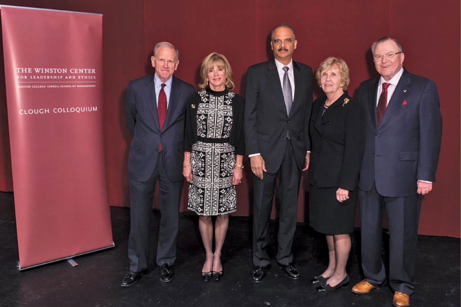 Former U.S. Attorney General Eric Holder (center) spoke at the Fall 2016 Clough Colloquium; here he poses with the Cloughs (left) and Winston Center benefactors Judy and Robert Winston '60 (right).